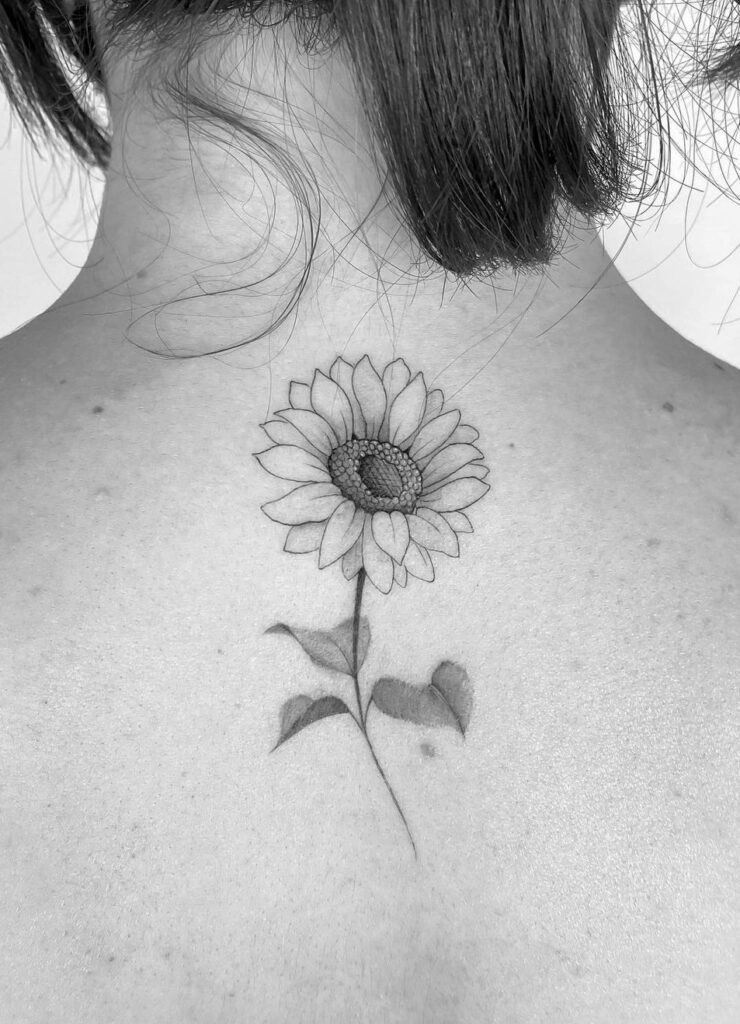 Back of neck sunflower tattoo