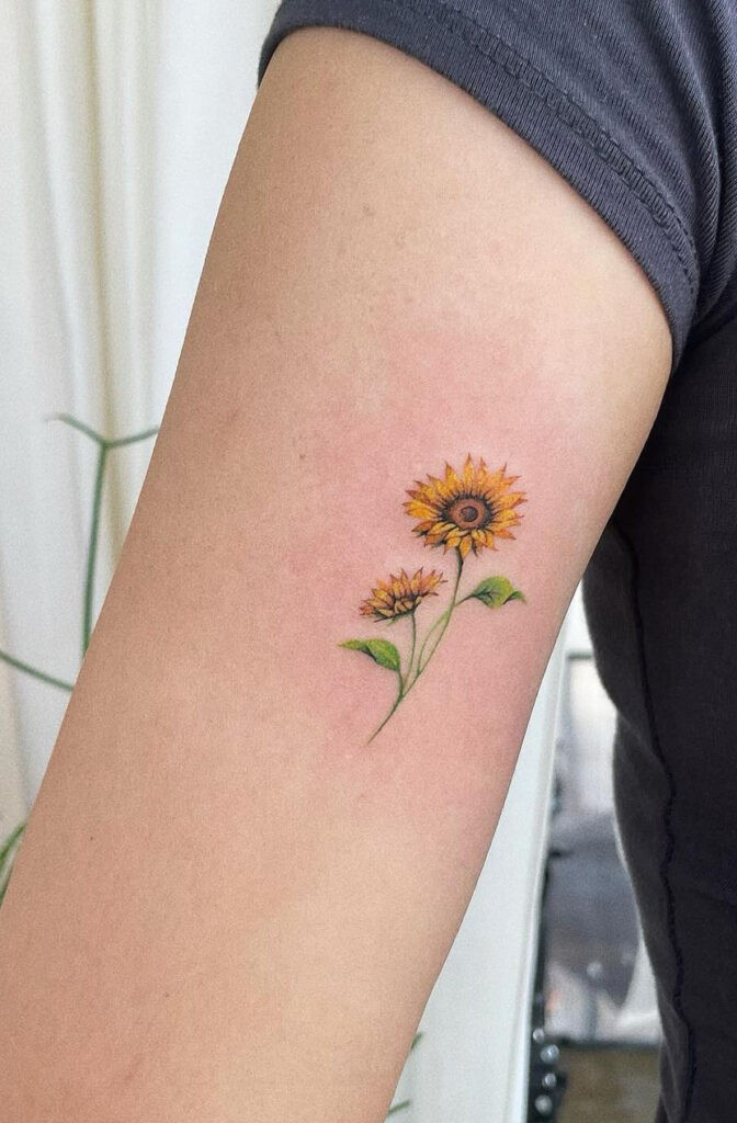 Colored detailed sunflower arm tattoo