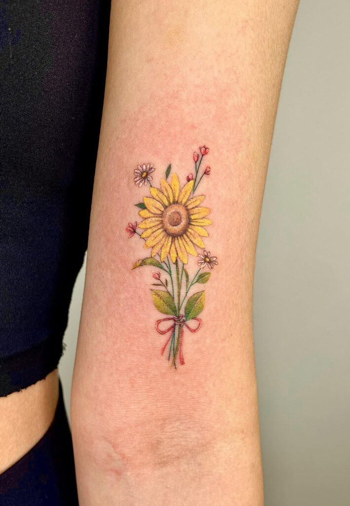 Sunflower &amp; flowers tied with a bow arm tattoo