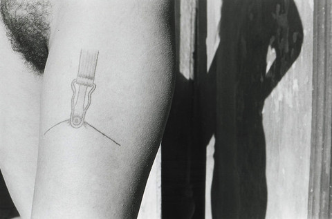 Close-up of Valie Export's suspender belt tattoo, a symbol of feminist art and body politics.