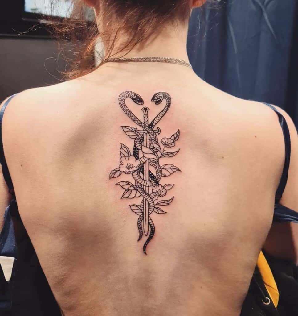 Fine line sword tattoo design, utilizing delicate and thin lines for a subtle and refined depiction of the sword.