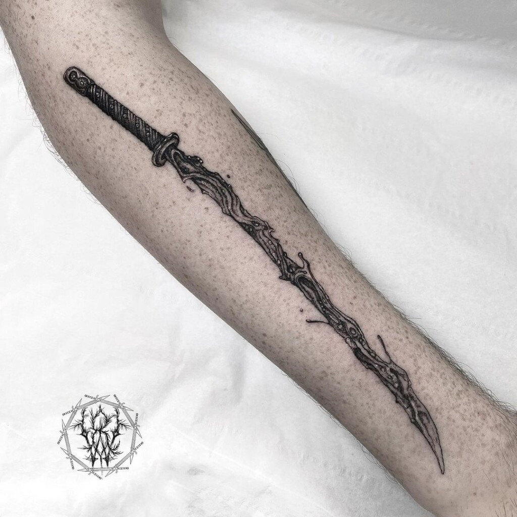 Realistic black and grey sword tattoo design, utilizing black and grey ink to create depth, dimension, and realism.