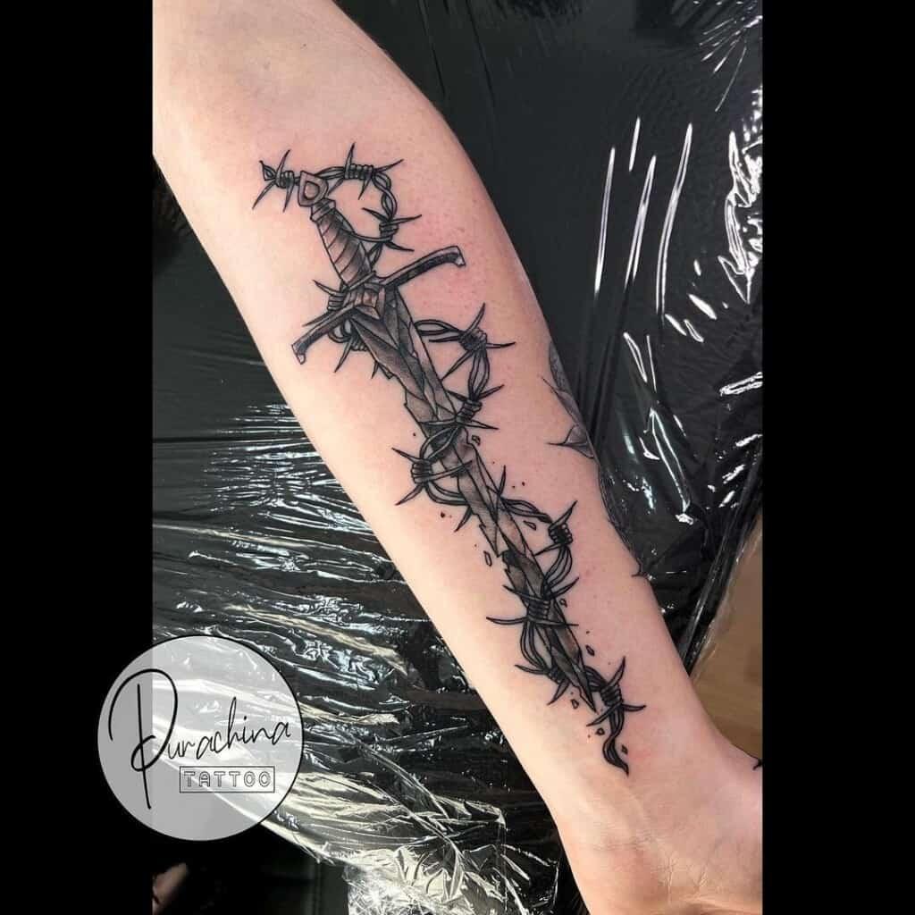Ornamental dagger tattoo design, featuring decorative elements and embellishments, transforming the dagger into an ornate piece of body art.