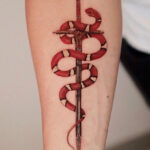 Snake and sword tattoo meaning is a powerful symbol of resilience, courage, and transformation. The snake in this design represents healing and rebirth, while the sword symbolizes strength and protection.