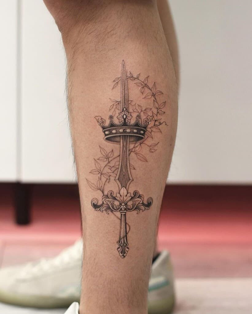 Crown and sword tattoo symbolizing authority, strength, and protection, with the crown representing nobility and leadership.