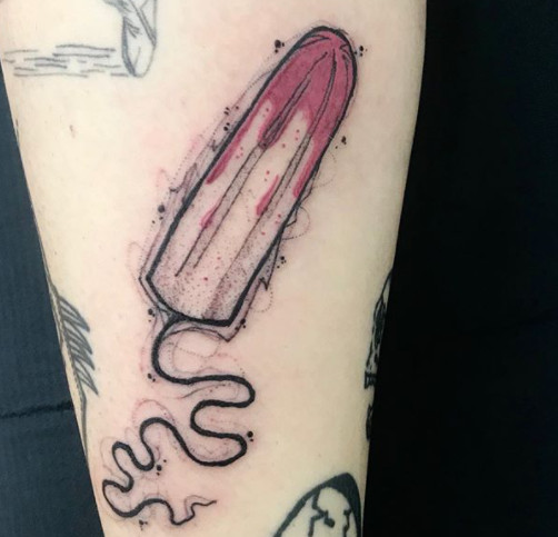 A tampon with tattoo ink instead of blood, symbolizing menstruation and tattoos.