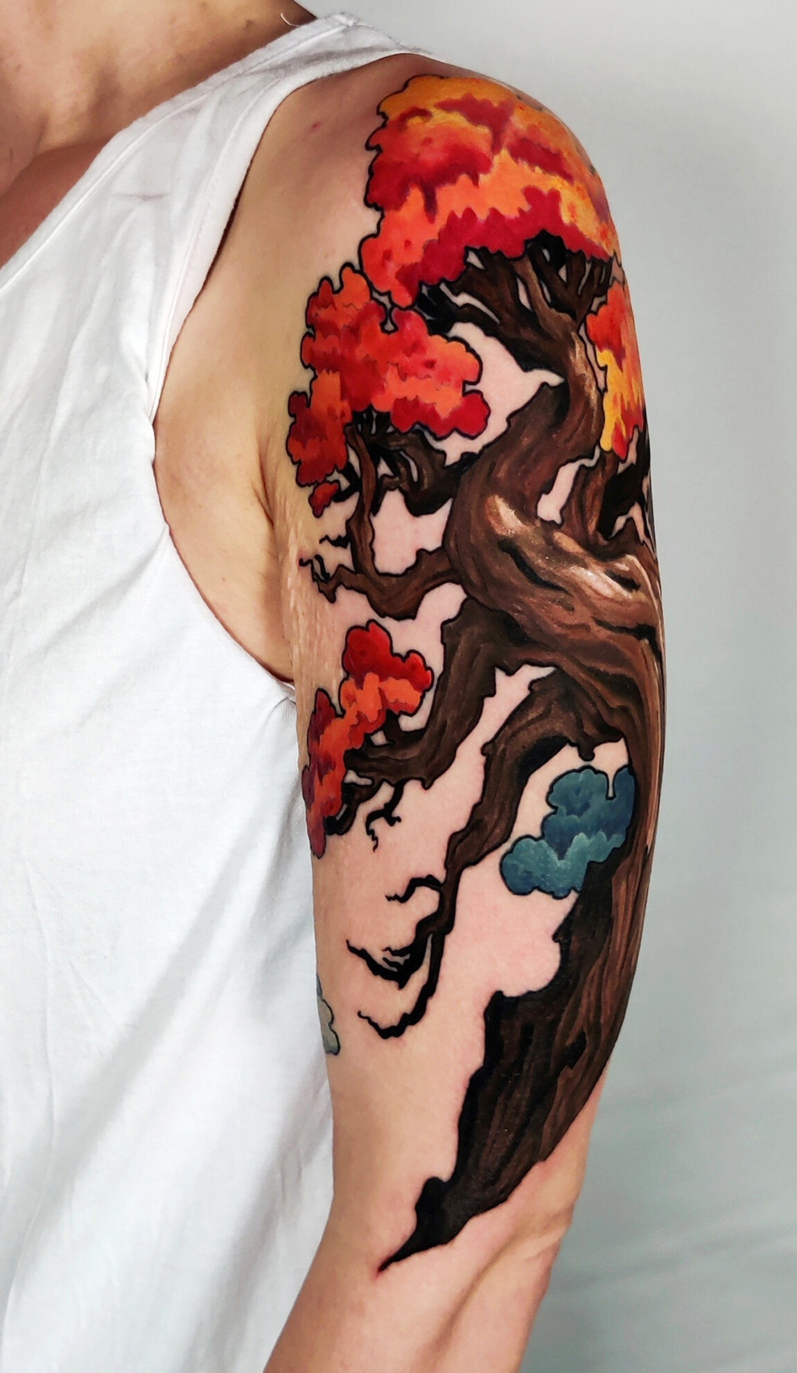 Vibrant Neo Traditional tattoo featuring rich colors and bold lines, created by Bara at Grand Reaper Tattoo