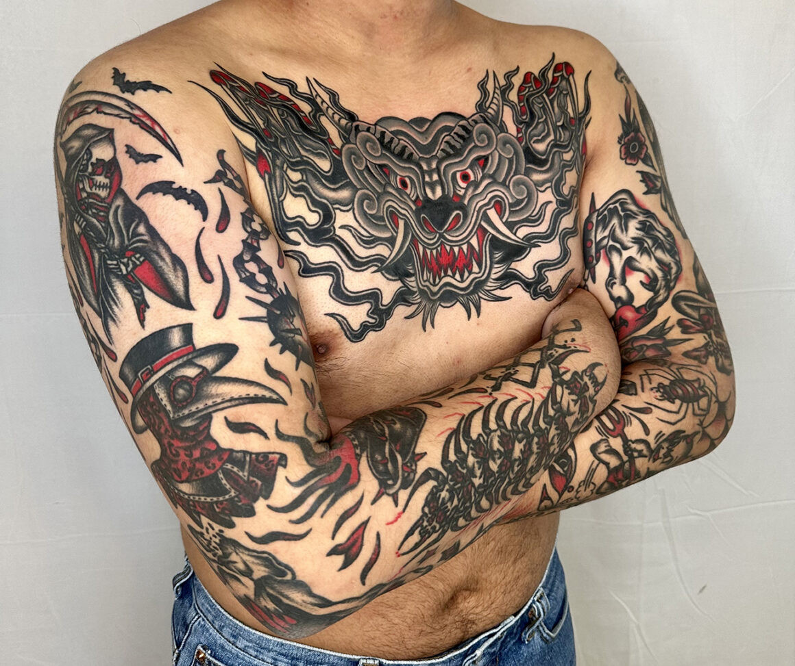 Tattoo by Ducky, showcasing bold traditional style and intricate linework
