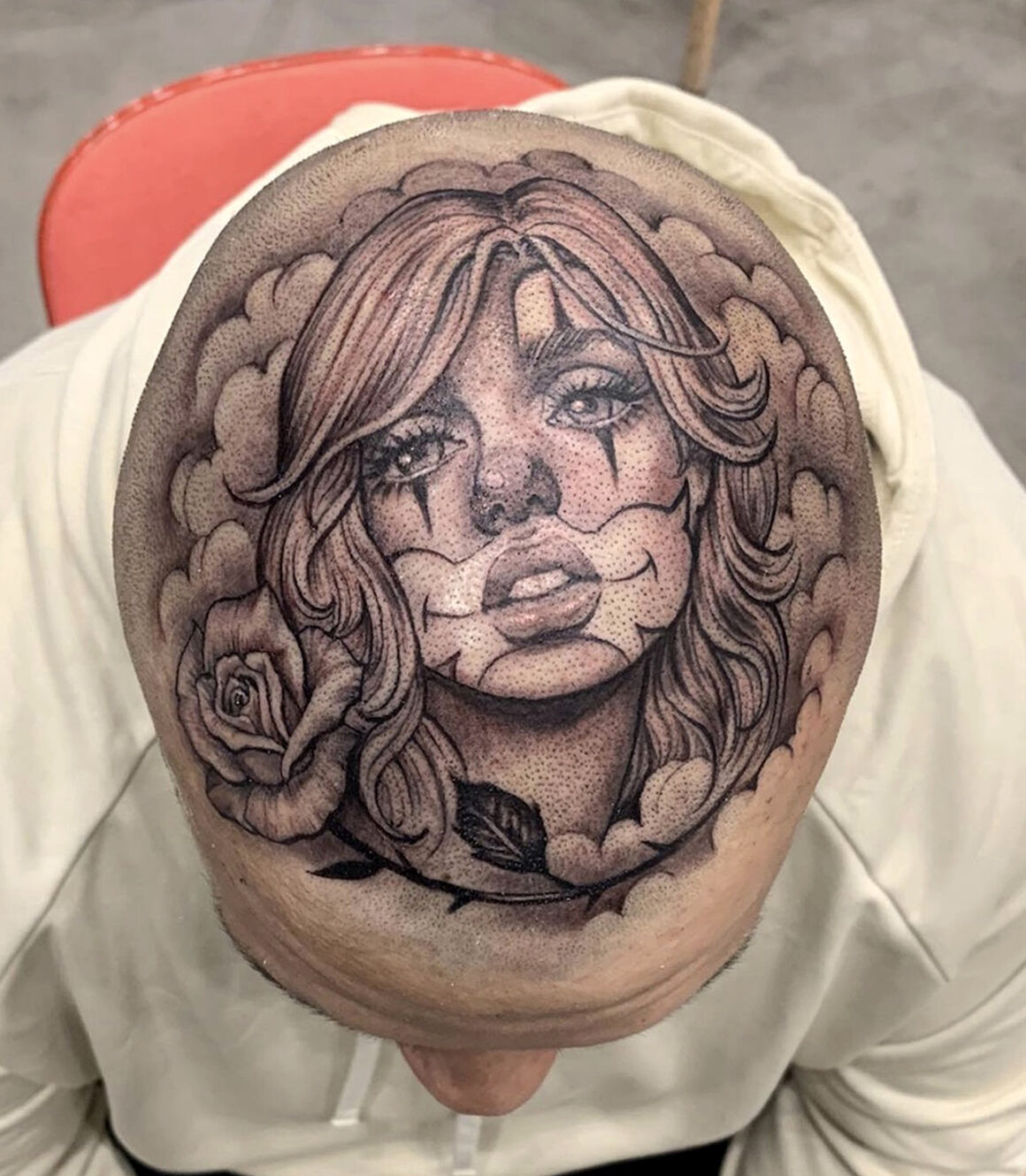 Detailed black and grey Mexican style tattoo of a woman's face, by Elvia Guadian