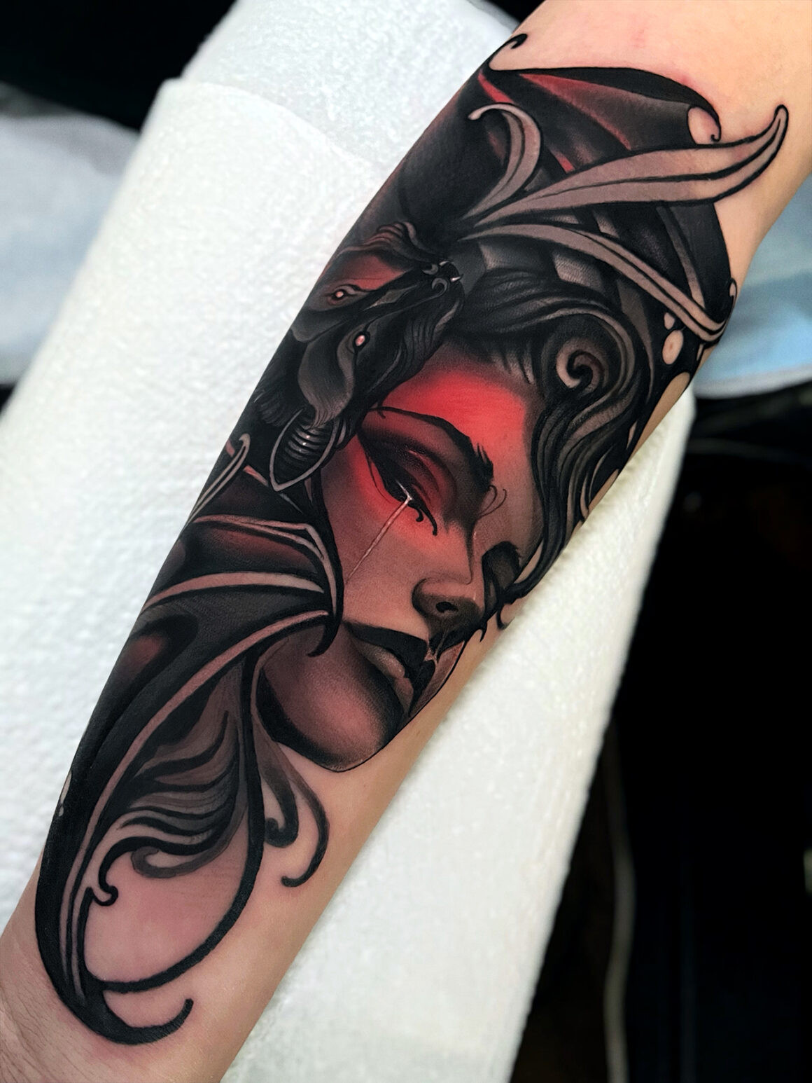 Stunning completed female face tattoo by Tony Faith, exemplifying his mastery of the craft.