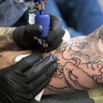 Custom alchemy tattoo in St. Louis by expert artist, showcasing intricate detail and personalized symbolic design.