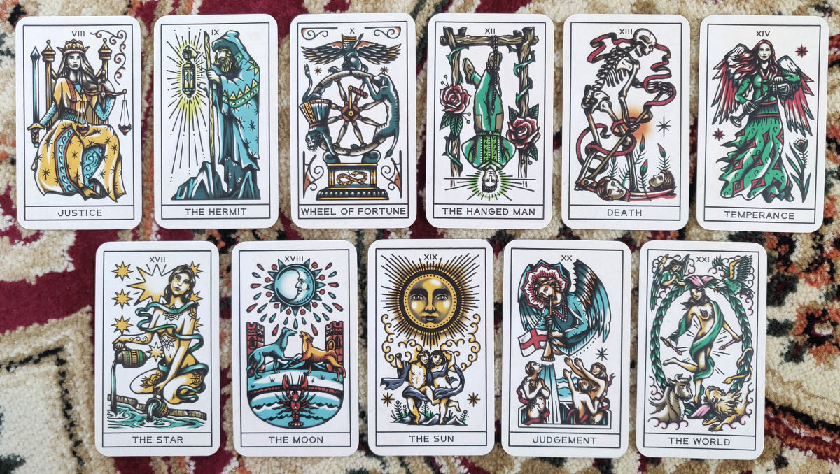 Close-up view of more Major Arcana cards from the Tattoo Tarot, highlighting the detailed linework and symbolic imagery within the tattoo-inspired designs.