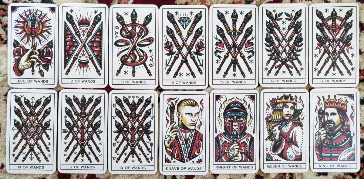 Group of Tattoo Tarot cards fanned out, showcasing the matte finish, clean lines, and balanced color and white space ideal for tarot readings.