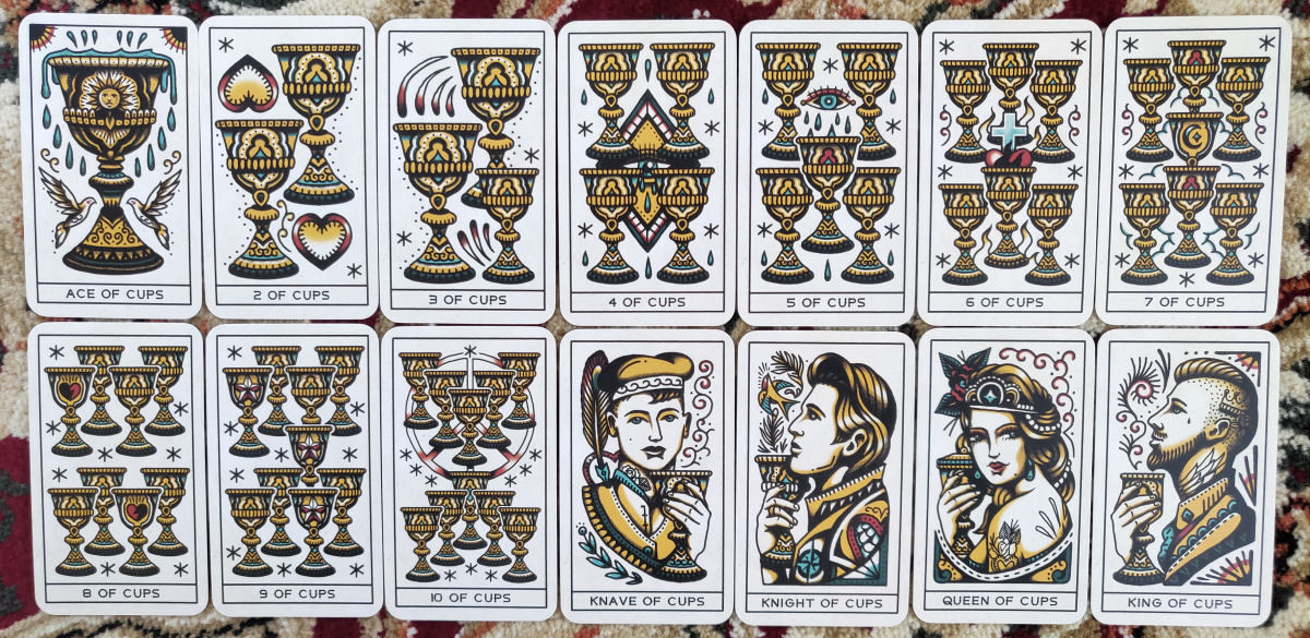 A hand shuffling the Tattoo Tarot deck, demonstrating the card size and matte finish, highlighting the deck's usability and high production quality for tarot readings.