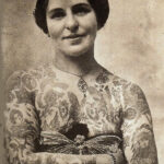 Victorian lady with butterfly tattoos and butterfly embroidery