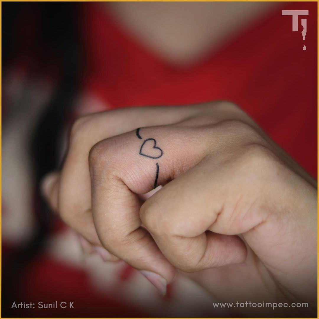 Heart ring tattoo on the finger