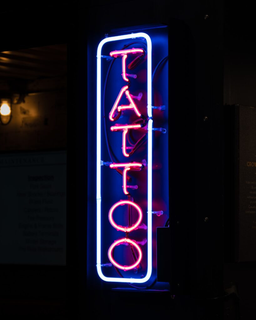 Tattoo artist at Illustrative.TO studio working on a client's arm