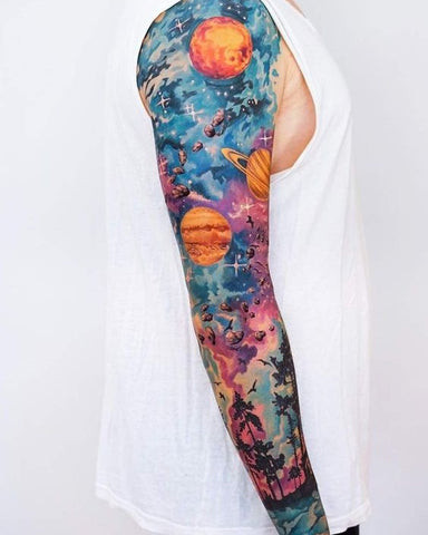 Space sleeve tattoo featuring planets, stars, and nebulae in vibrant cosmic colors