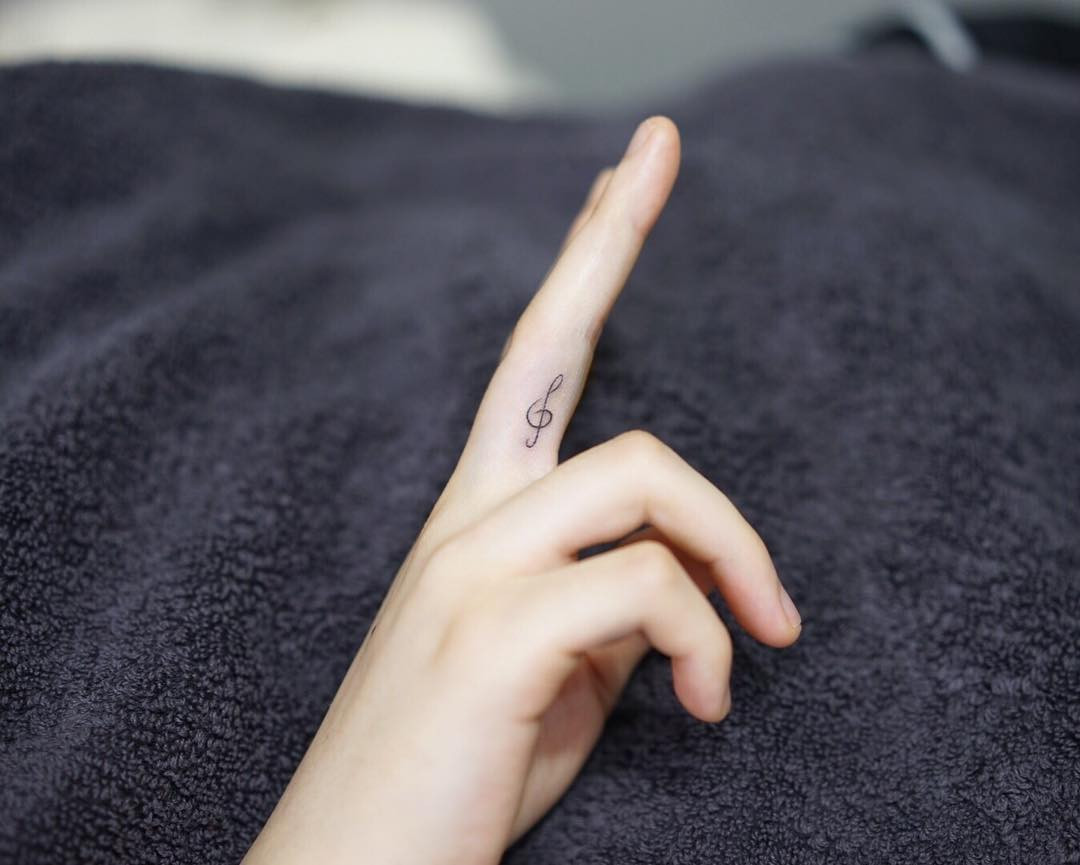 Musical note finger tattoo for music lovers