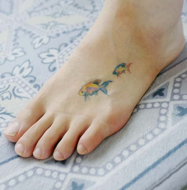 delicate foot tattoo