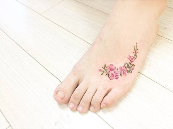 feminine delicate tattoo on foot