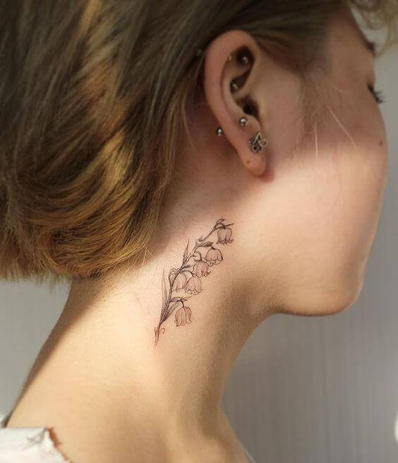 feminine delicate tattoo on neck