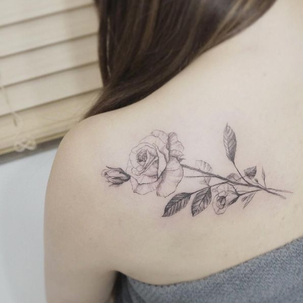 feminine delicate tattoo on shoulder