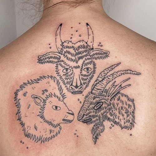 Taurus bull and Leo lion combination tattoo on the chest