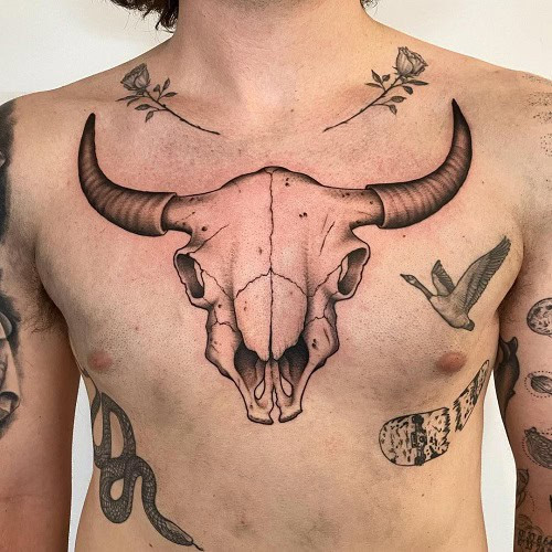 Taurus bull skull tattoo with an American flag design on the head