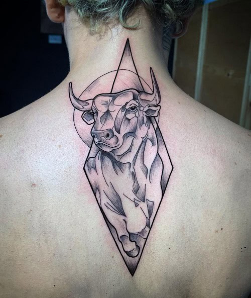 Small black ink Taurus constellation tattoo behind the ear on the neck