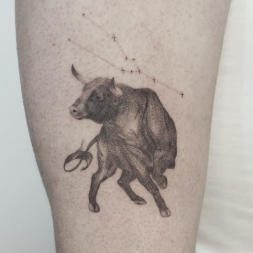 Taurus bull head tattoo on a man's shoulder