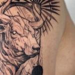 Detailed black ink Taurus bull tattoo on forearm