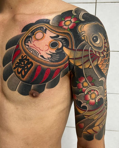 Tengu half sleeve tattoo featuring a Tengu mask with cherry blossoms and clouds in Japanese style