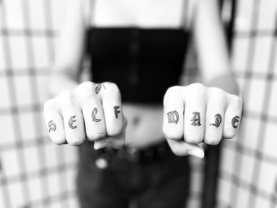 Knuckle tattoos with meaningful words for women