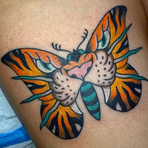 Harmonious tiger butterfly tattoo combining strength and freedom