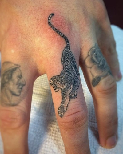 Unique tiger finger tattoo for subtle yet striking detail