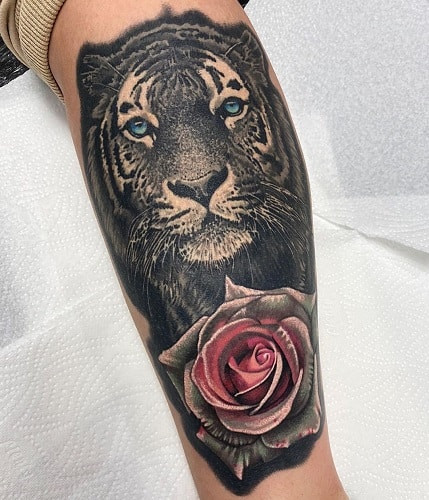 Romantic tiger rose tattoo blending strength and passion