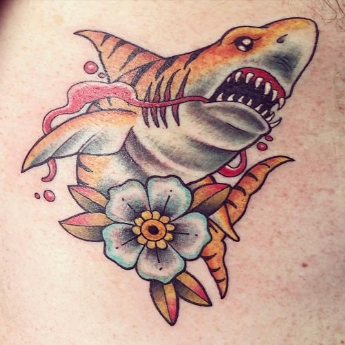 Dynamic tiger shark tattoo symbolizing relentless spirit