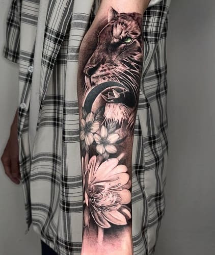 Harmonious tiger with flowers tattoo balancing power and fragility