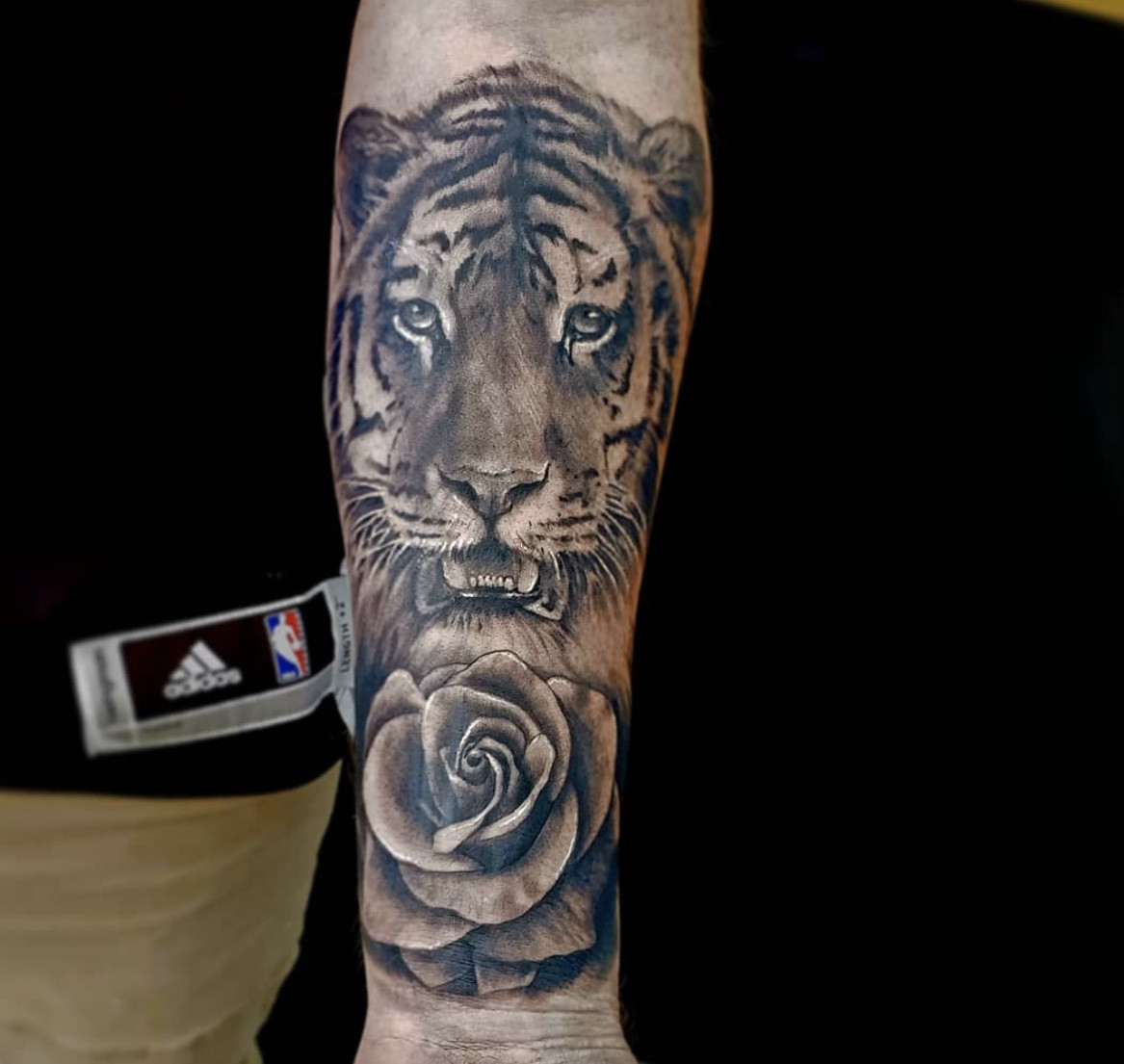 Fierce tiger and rose tattoo contrast