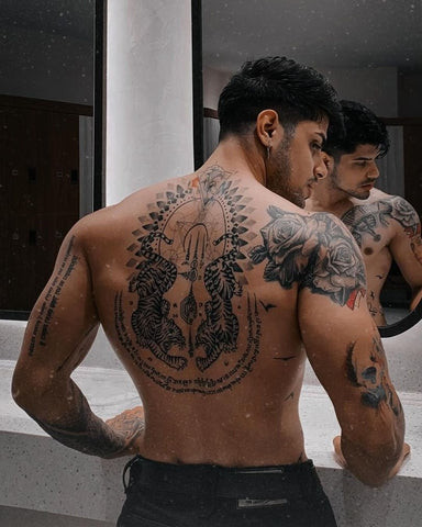 Tiger back tattoo art powerfully covering the back, symbolizing strength and power