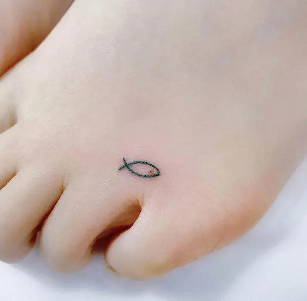 Tiny fish foot tattoo, symbolizing freedom, flexibility, prosperity, and wealth across cultures