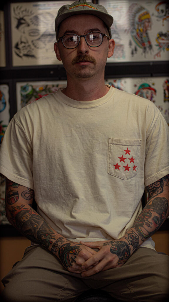 Tommy Davis portrait, a tattoo artist at Saint Tattoo in Knoxville, TN, known for American Traditional style.