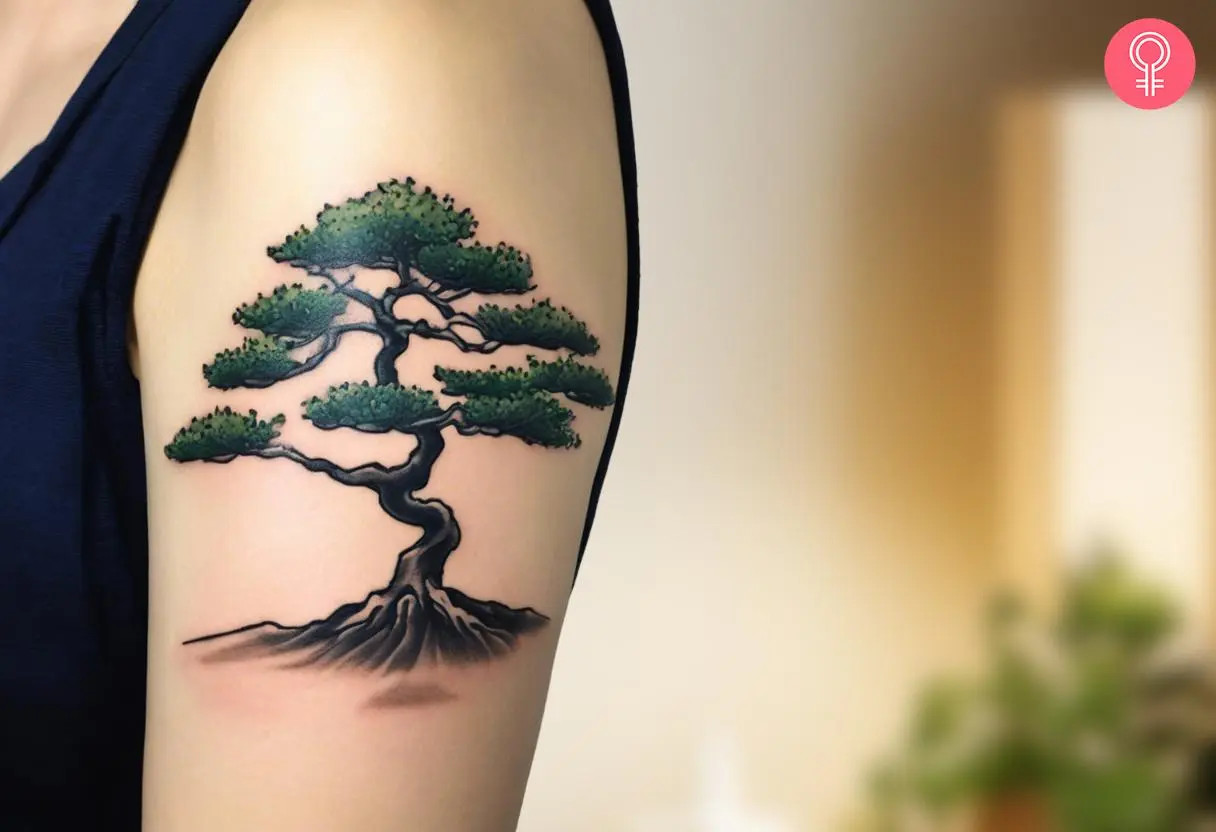 A woman displays a traditionally colored bonsai tree tattoo on her upper arm, featuring rich green and black ink to symbolize tranquility and craftsmanship.