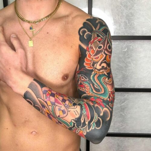 Full back traditional Japanese tattoo with vibrant colors depicting a warrior and mythical creatures