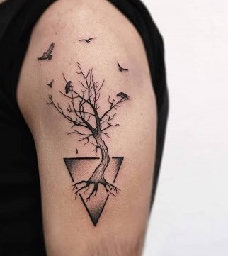 Symbolic tree and bird tattoo for men, representing the cycle of life and connection to nature
