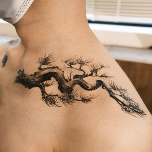 Detailed tree of life tattoo on the back, symbolizing growth in men tattoo ideas.