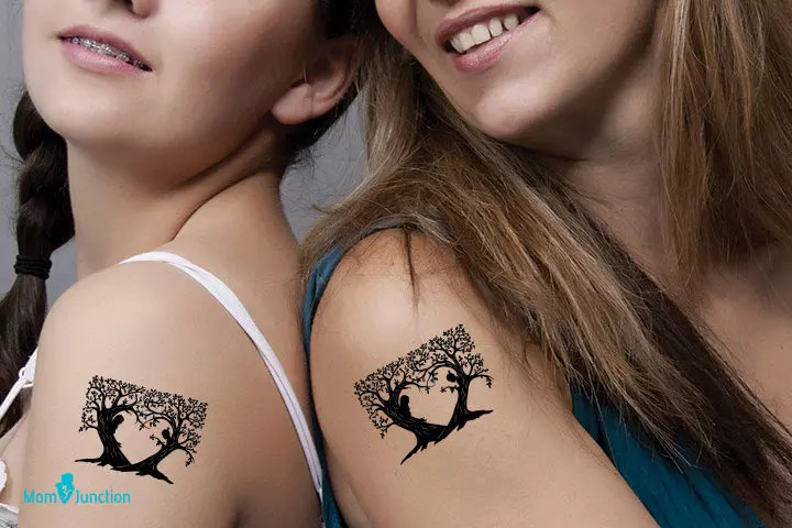 Matching tree mother-daughter tattoo, symbolizing shared roots and connection