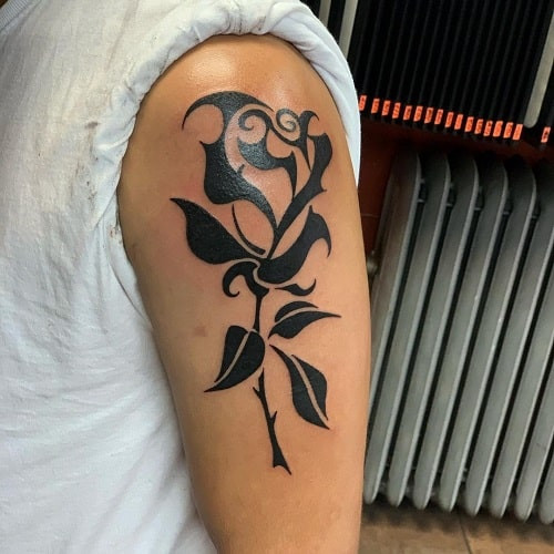 Bold tribal rose tattoo style