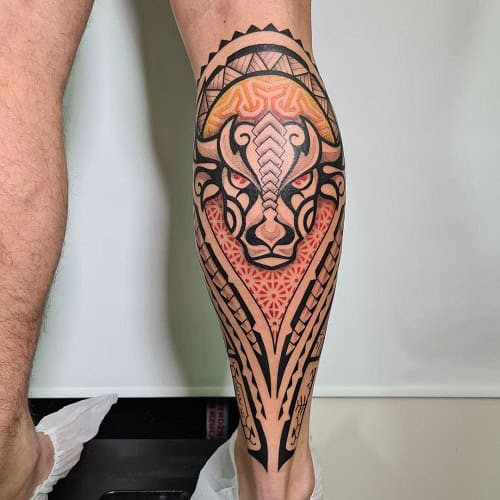 Black tribal style Taurus bull tattoo on the shoulder